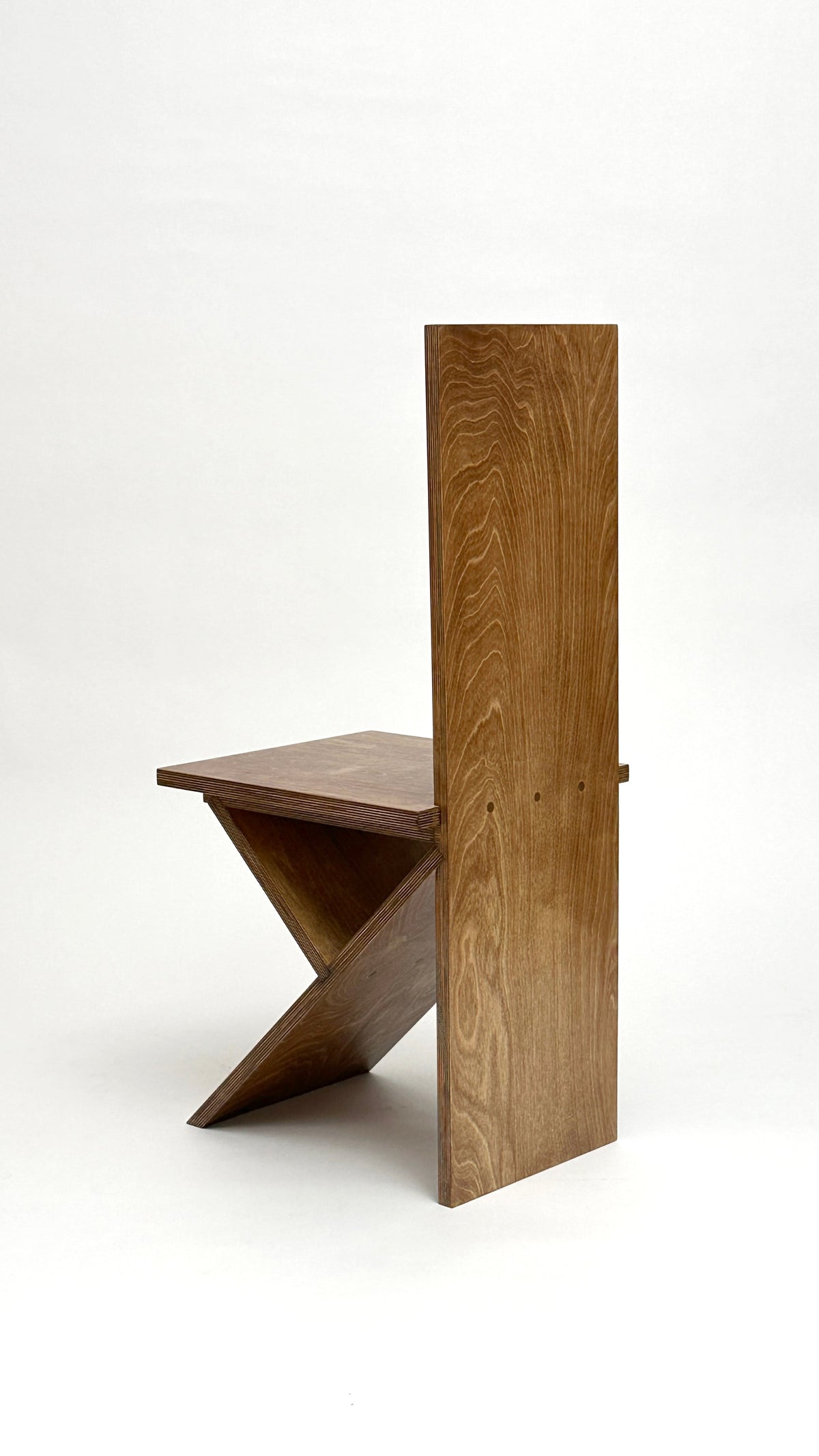 Flat Pack Chair by Goons — side view of wooden chair design