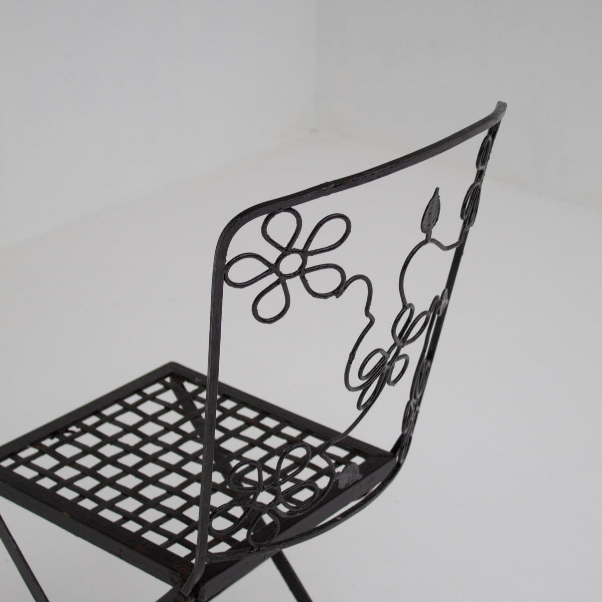 Set of Three Decorative Wrought Iron Garden Chairs with Floral Backrests — side angle