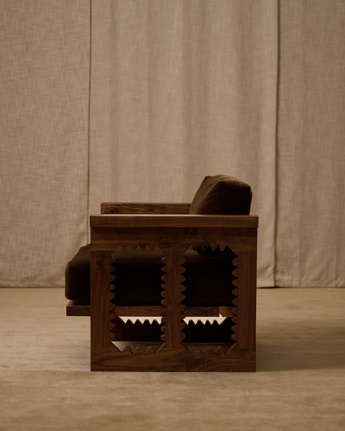 Jura wooden armchair with geometric lattice pattern detail