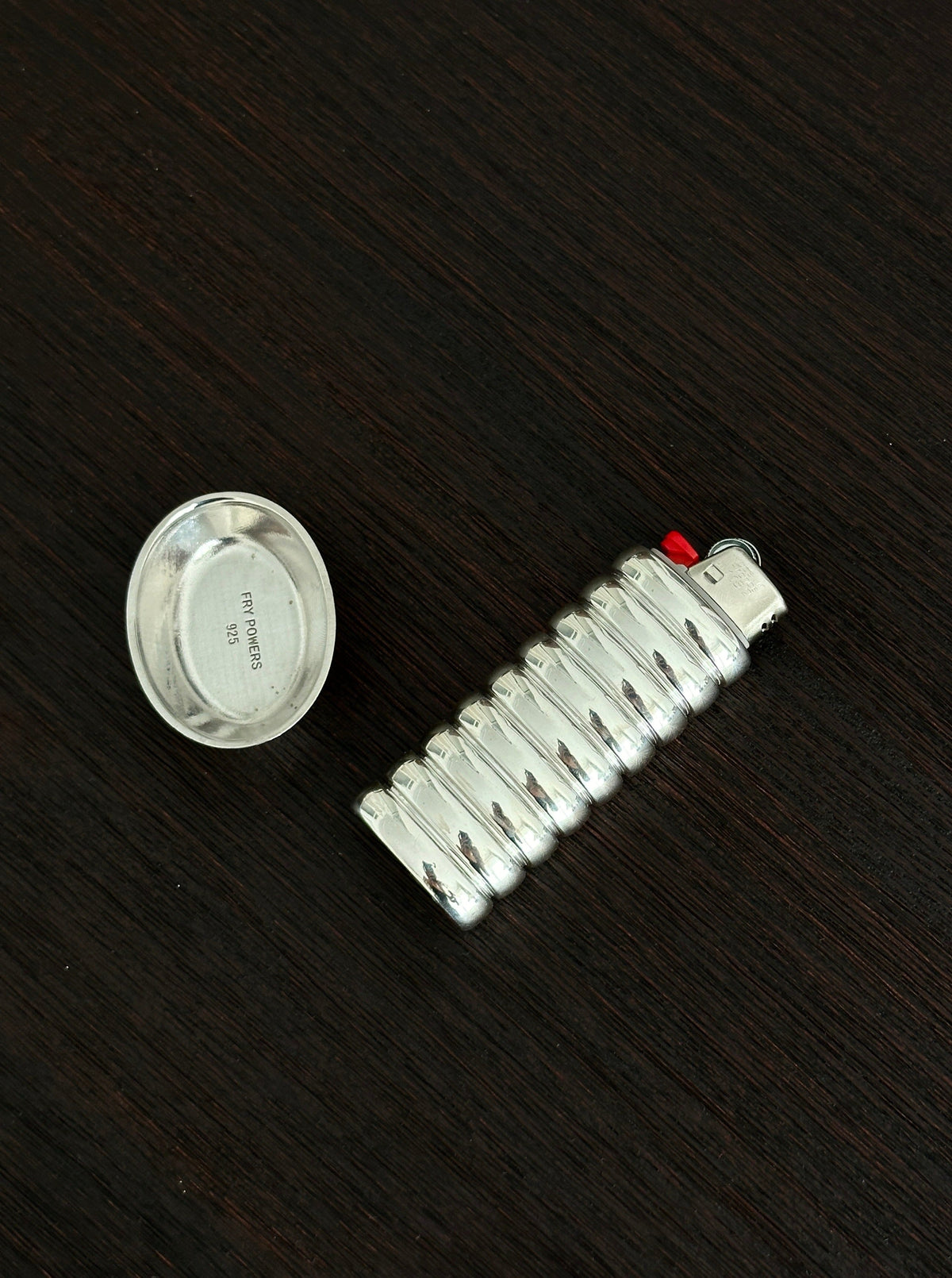Gio Lighter Holder — side angle on dark wood surface