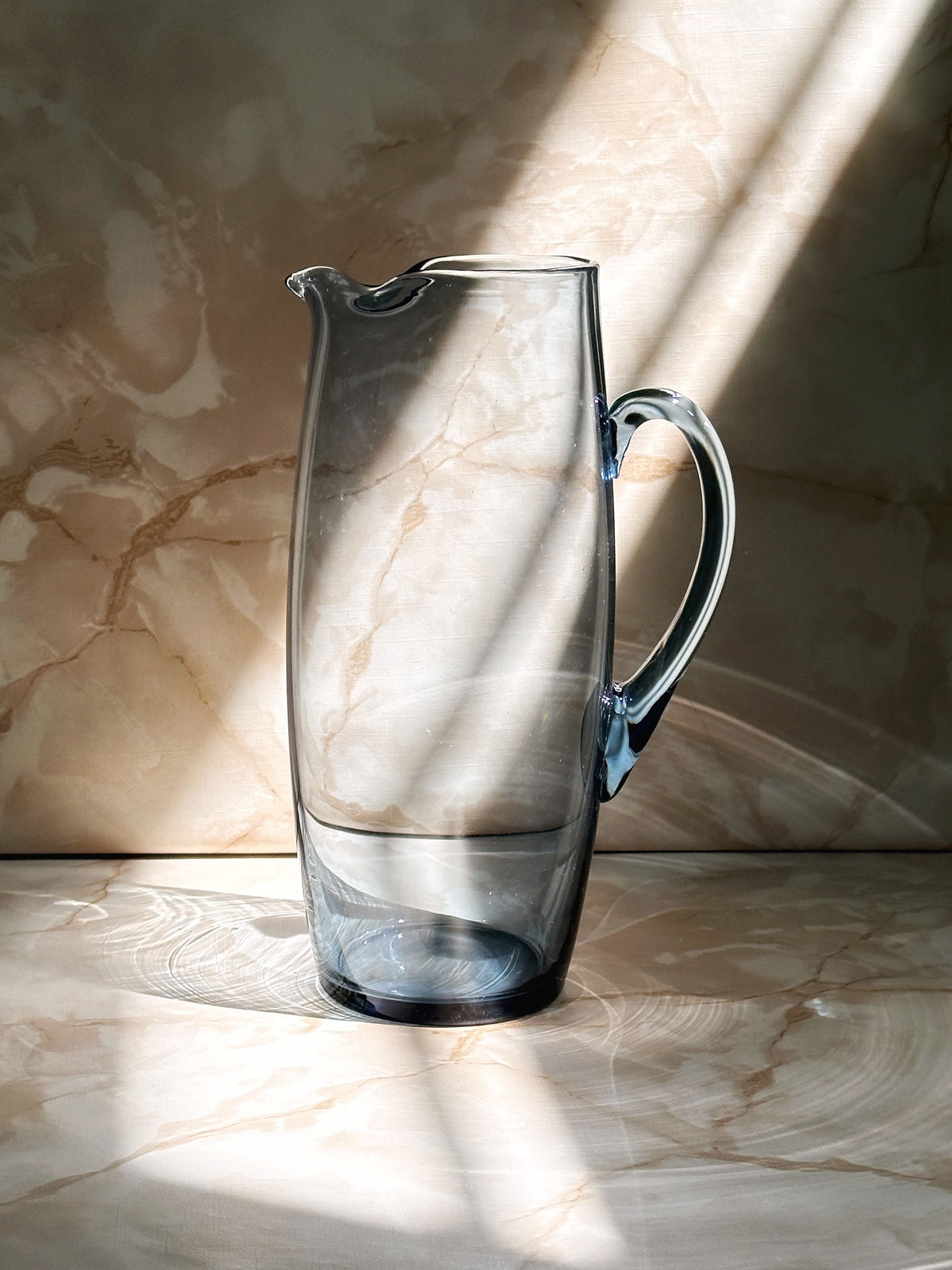 Per Lütken Smoked Blue Glass Carafe for Holmegaard - 1950s — lifestyle setting
