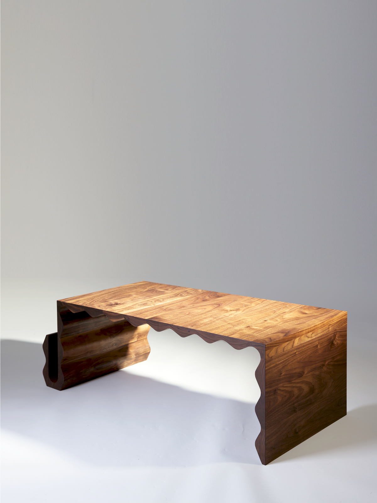 Optable Coffee Table — side angle showing walnut wood design