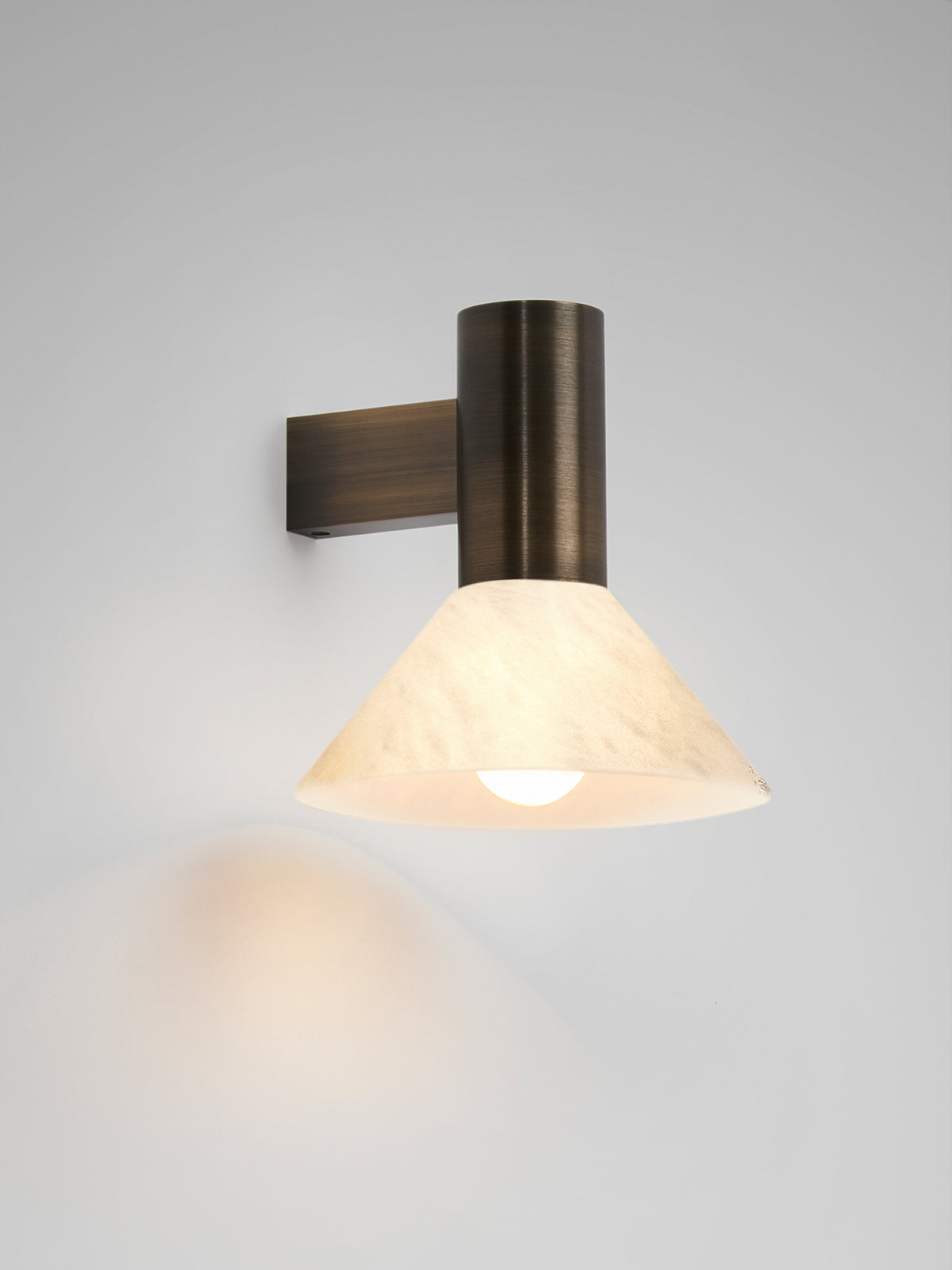 TORRES Wall — top view of cream shade with brass arm