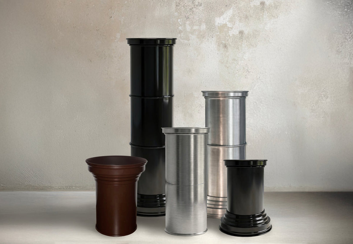 Contemporary End Tables in Mirror Metal — side angle of stacked cylindrical tables