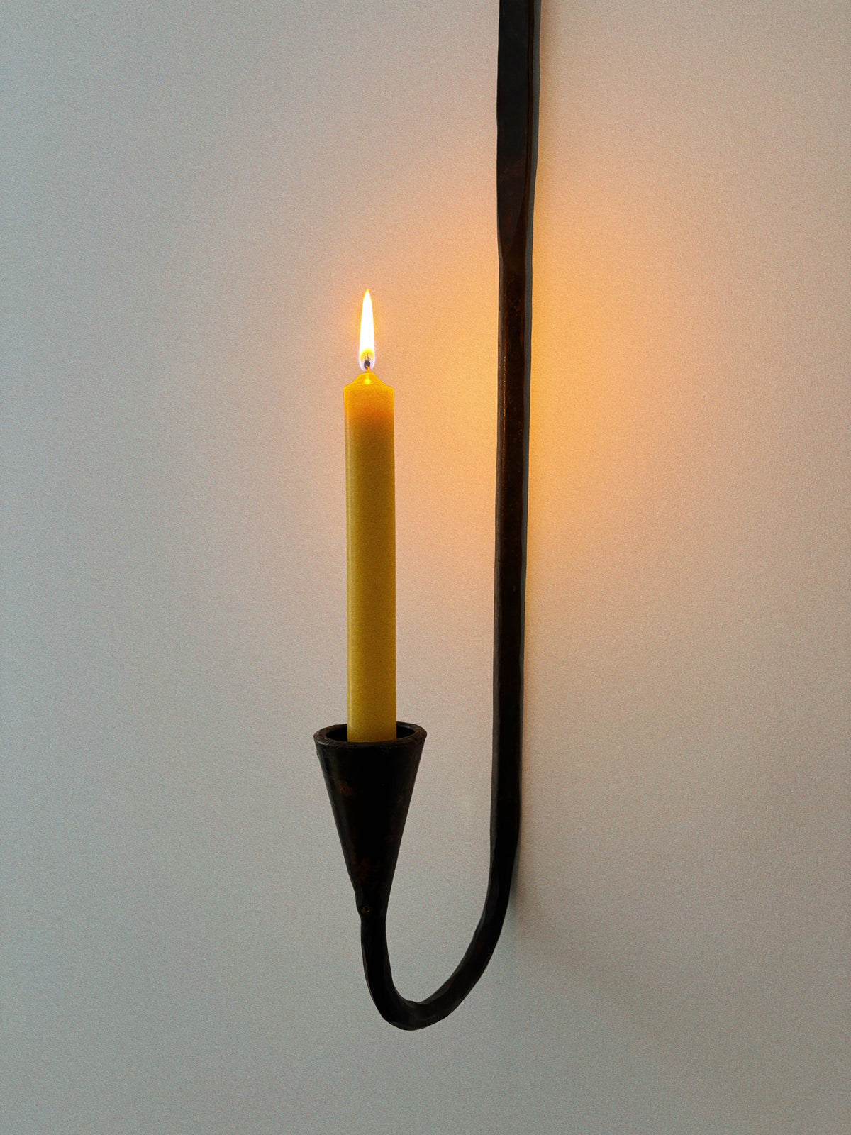 Set of 3 Large Danish Wrought Iron Wall Candlesticks, c. Late 1990s — side angle showing yellow candle in holder