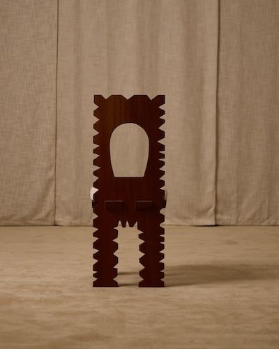 Jura chair sculptural profile showing carved wood geometric design