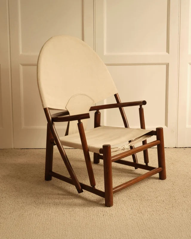 Three-quarter view of Hoop G23 lounge chair, walnut frame and cream canvas seat