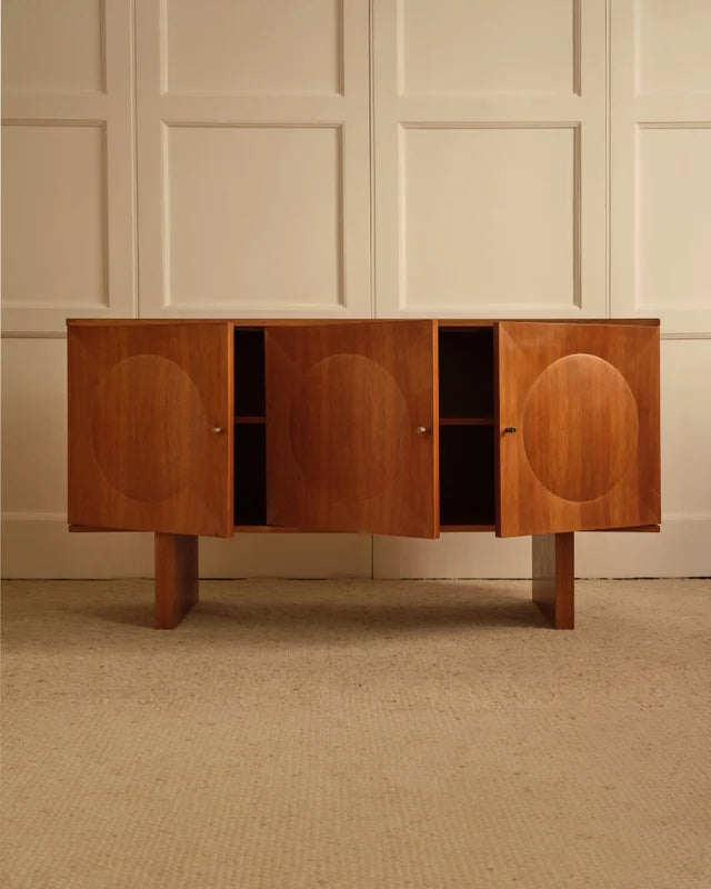 Open-door view of 1960s walnut sideboard with oval marquetry panels