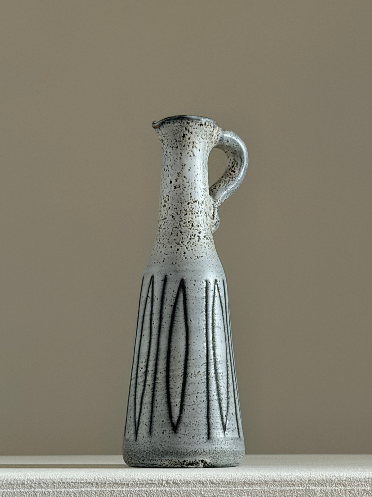 Small handled pitcher by Jacques Pouchain, Dieulefit, France, circa 1960.  — side angle