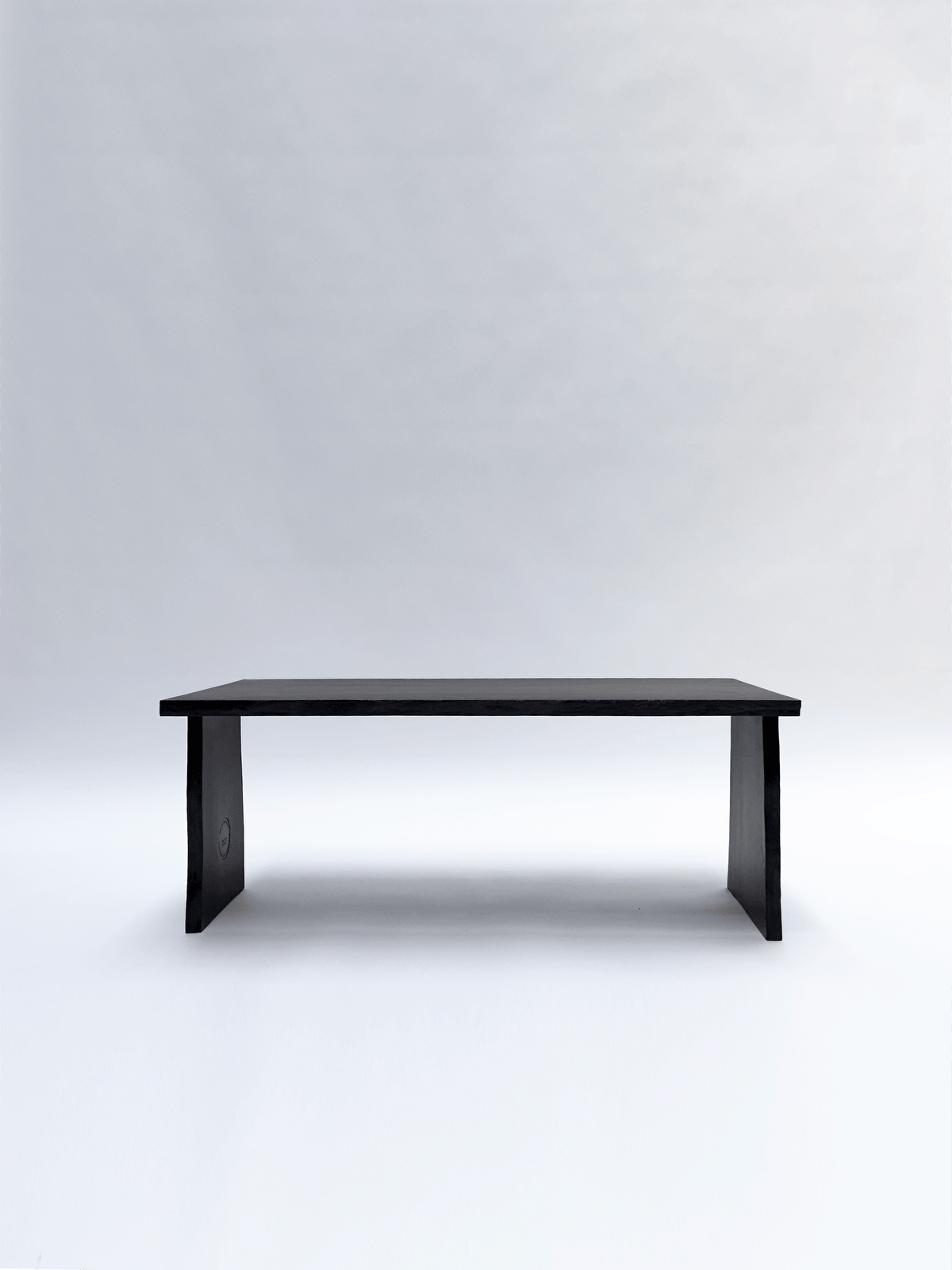 BO Coffee Table, 5500 Years Old Black Oak — side angle showing minimalist design and black finish