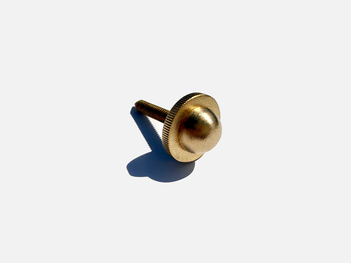 Brass thumbscrew detail of Eos pendant lamp hardware
