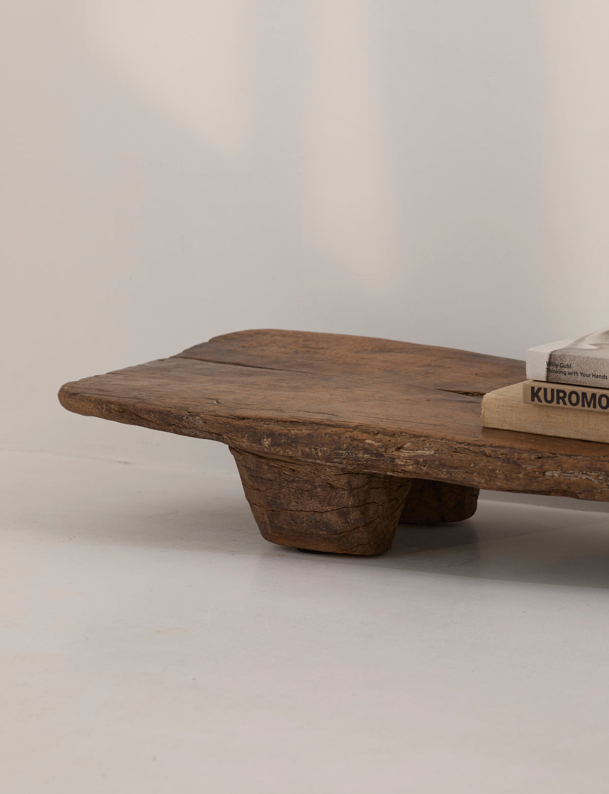 Carved Senufo Bench in Wood — top view of rustic wooden seat
