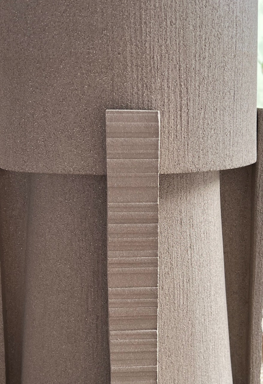 Hold ceramic table lamp construction detail showing layered material joint