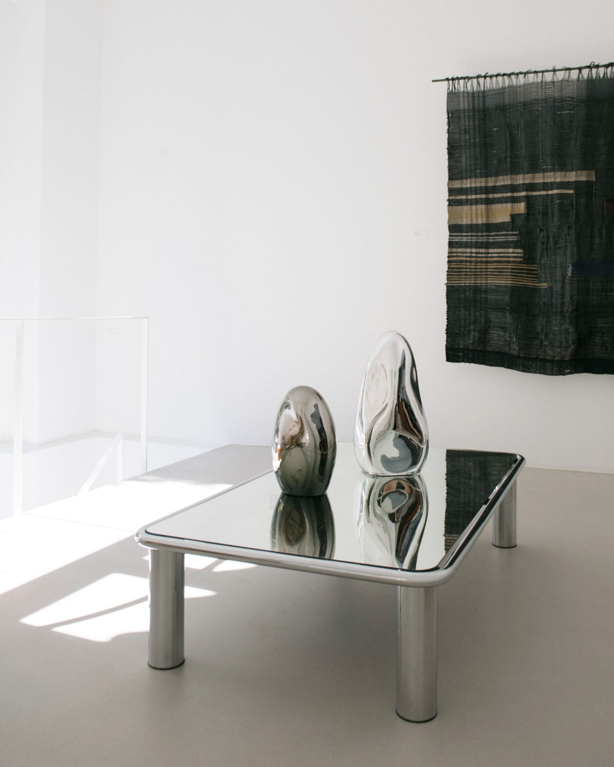 Standing Mirror Glass Sculpture No. 21 | color silver — top view on reflective table