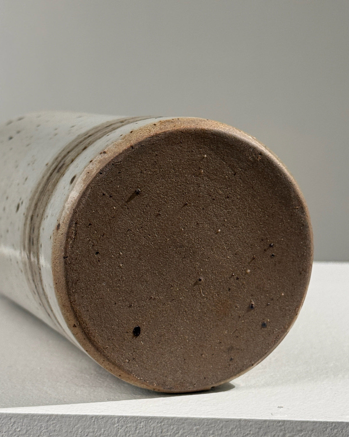 Bottom view detail of pyrited stoneware bottle showing textured base