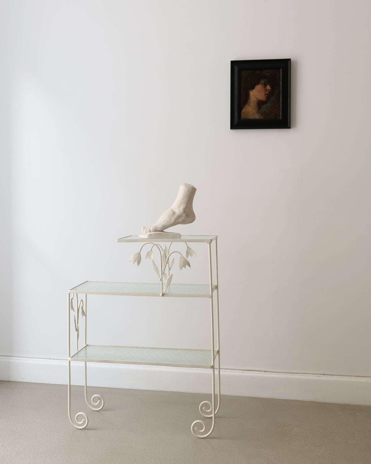 Anatomical foot sculpture on decorative glass stand lifestyle view