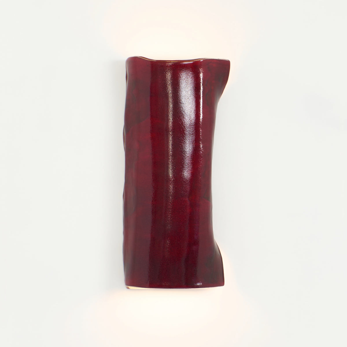 Papel Wall Light (large) — close-up of glossy red ceramic surface