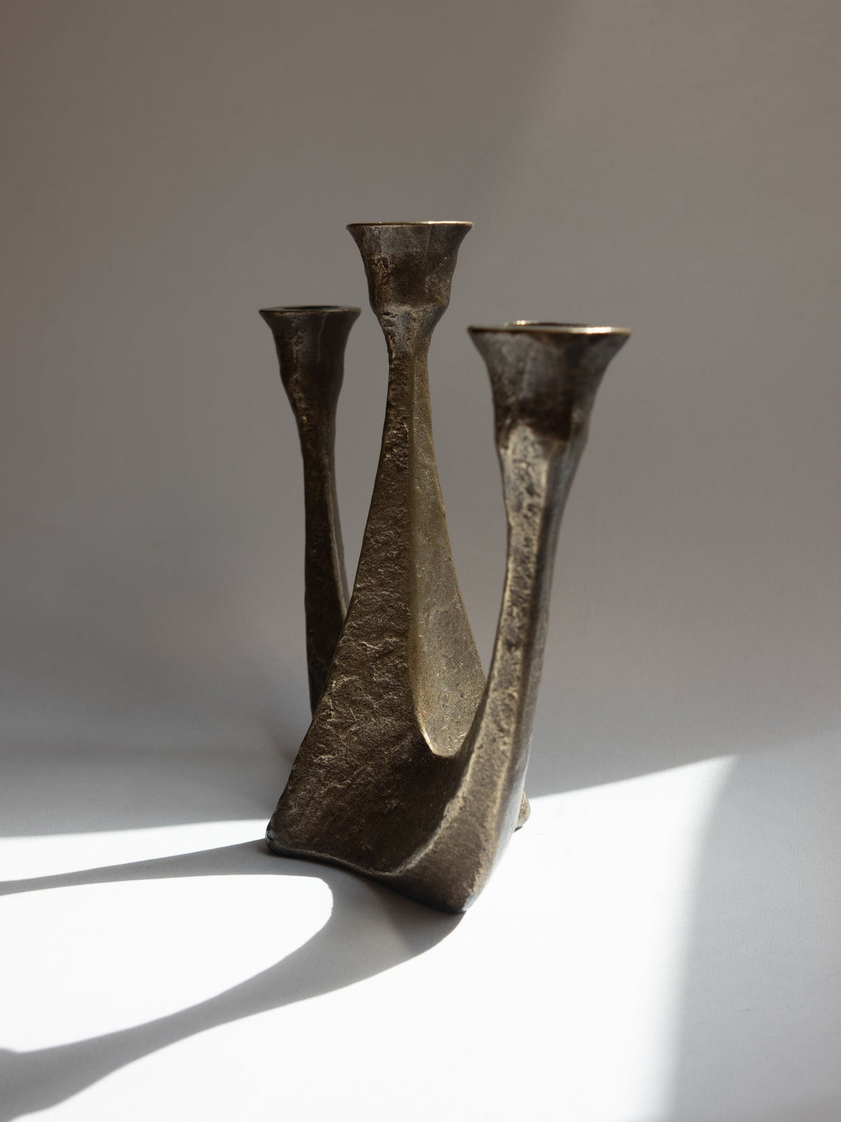 Brutalist bronze candelabra, three-arm cast texture, Germany 1970s