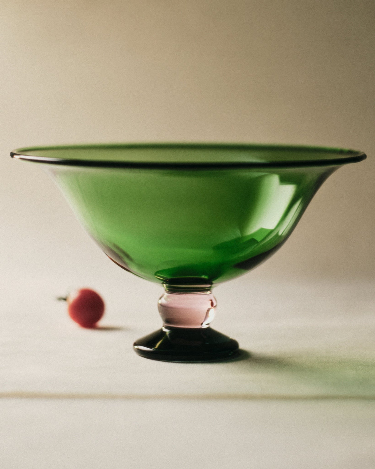 Fruit Bowl — side view of green glass with pink base