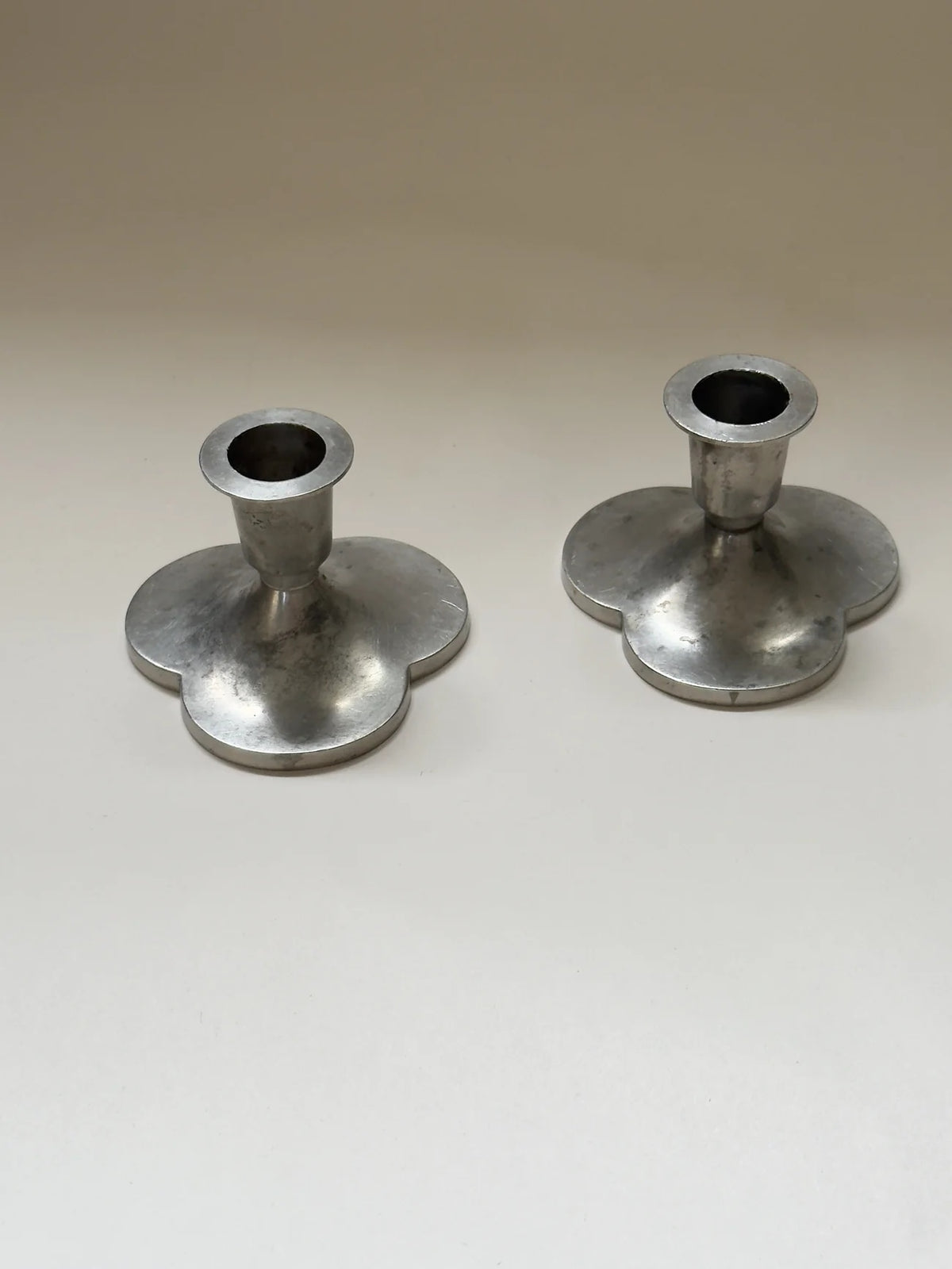 Pair of Pewter Candlesticks by Just Andersen — back view showing round bases