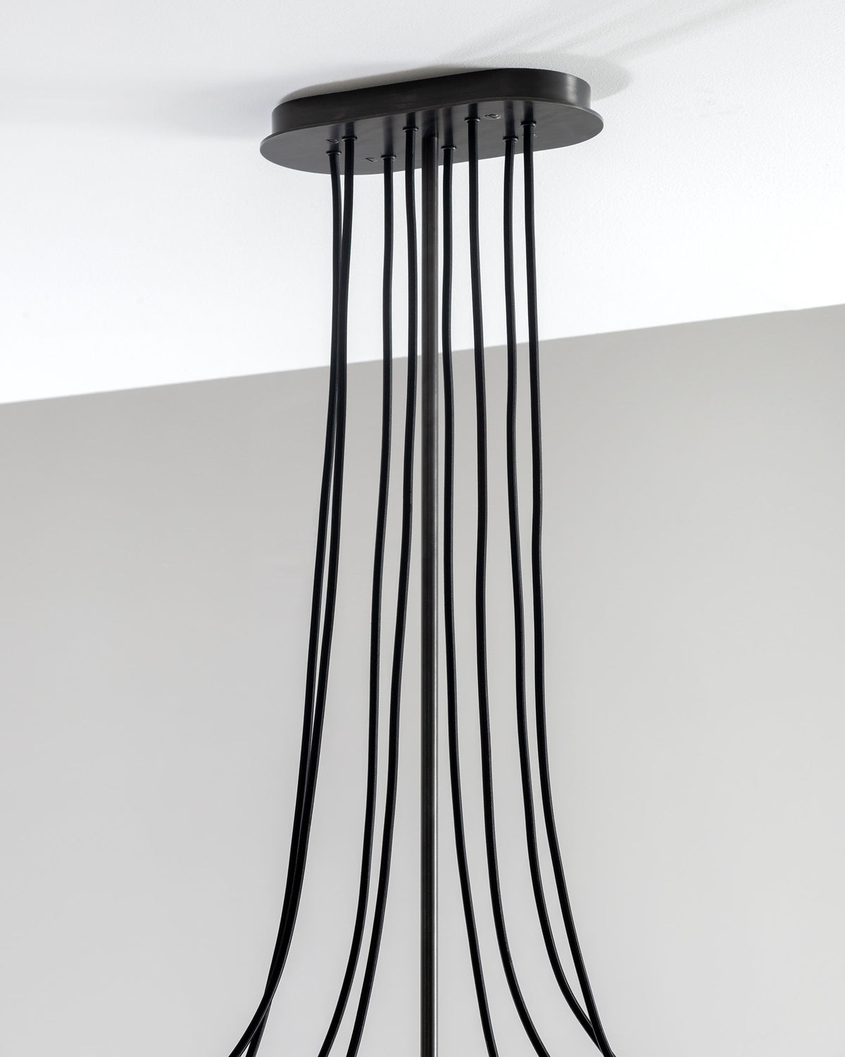 SkLO Drape Arm 8 Chandelier - Olivin glass, Dark Oxidized finish — lifestyle setting