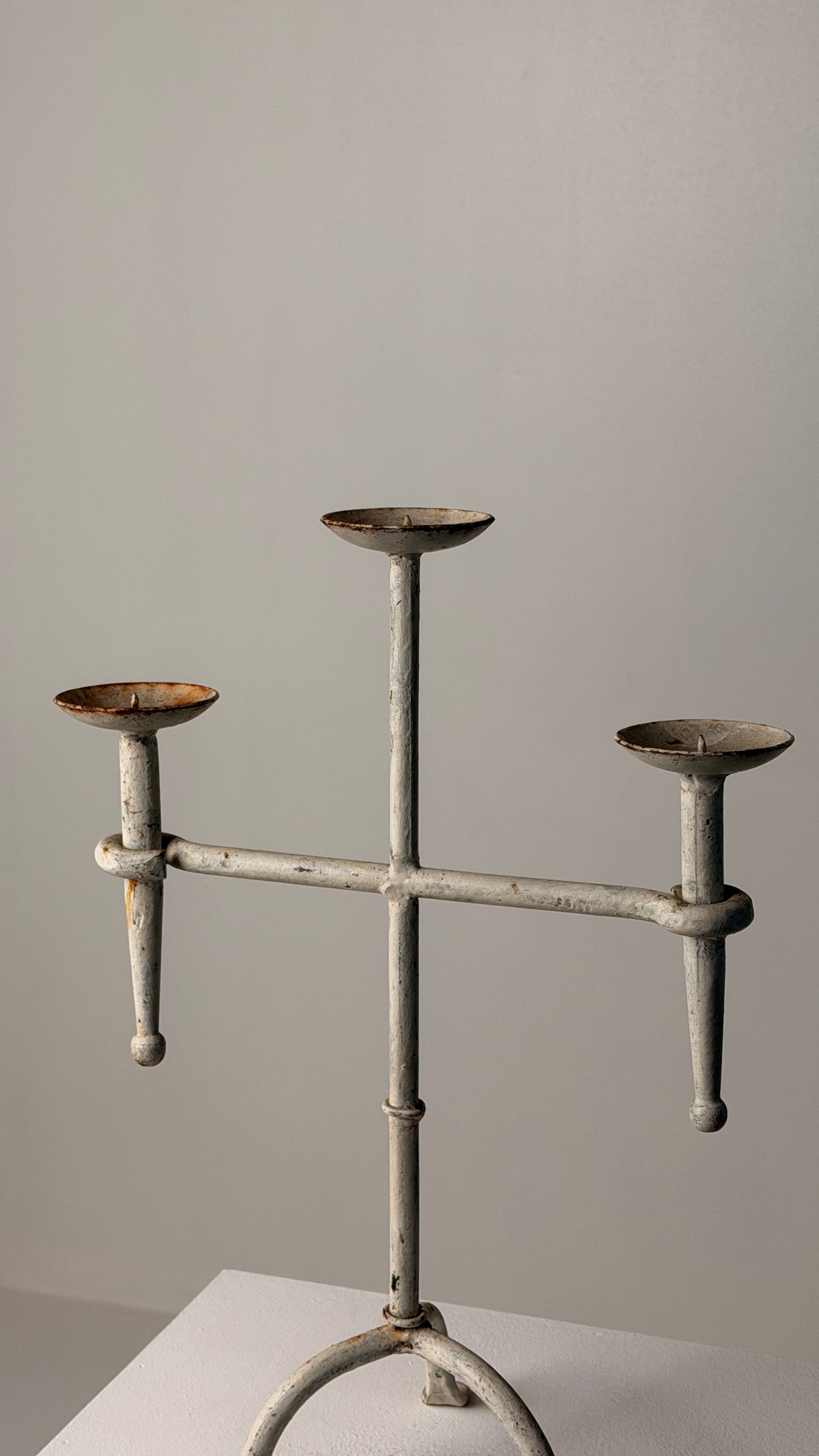 White-patinated Iron Candelabrum, France, early 20th century — side angle showing three candle holders