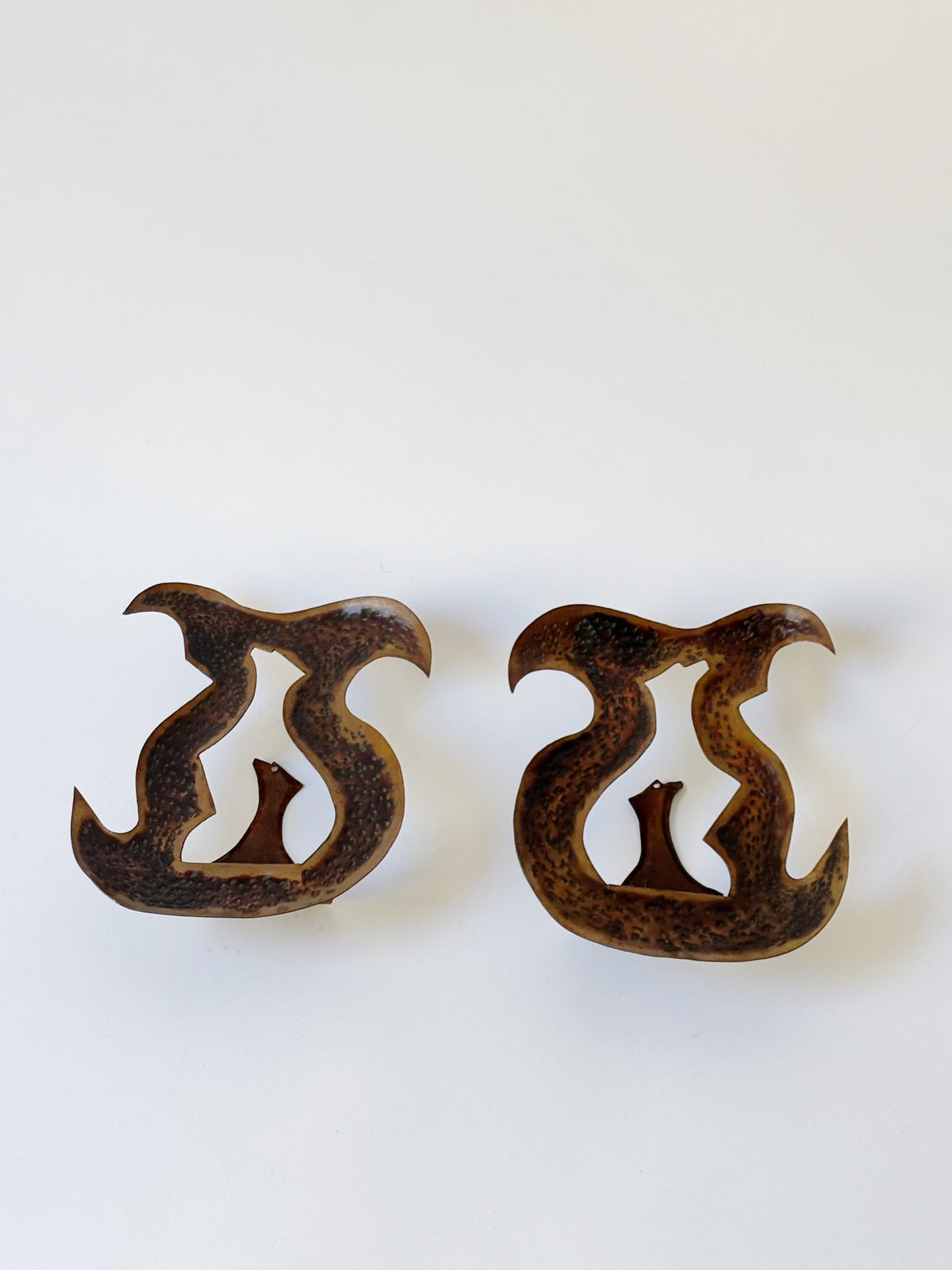 Pair of Torch Cut Metal Wall Candleholders, Poland — side angle