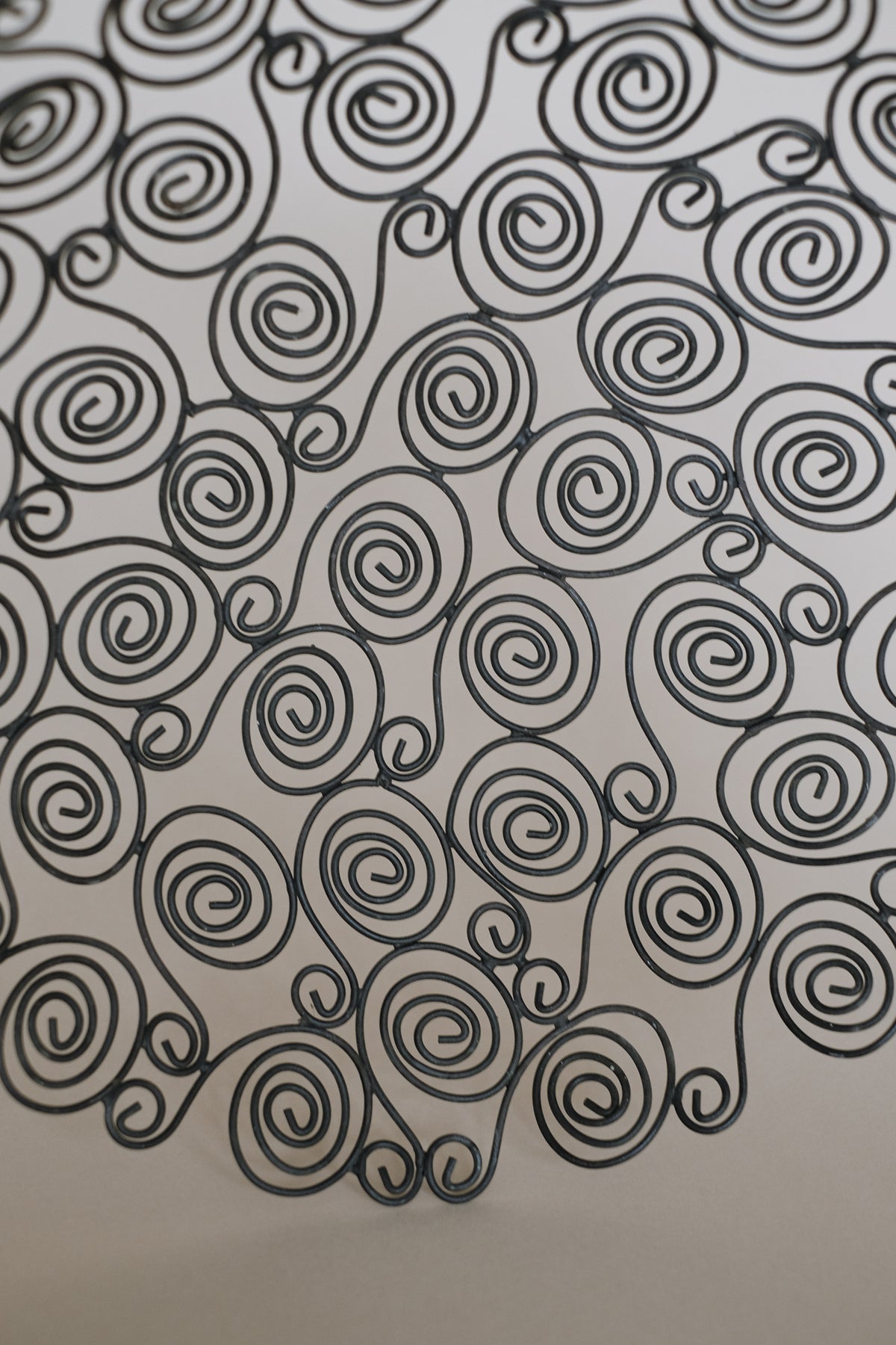 Spiral wire pattern detail of decorative metal bowl