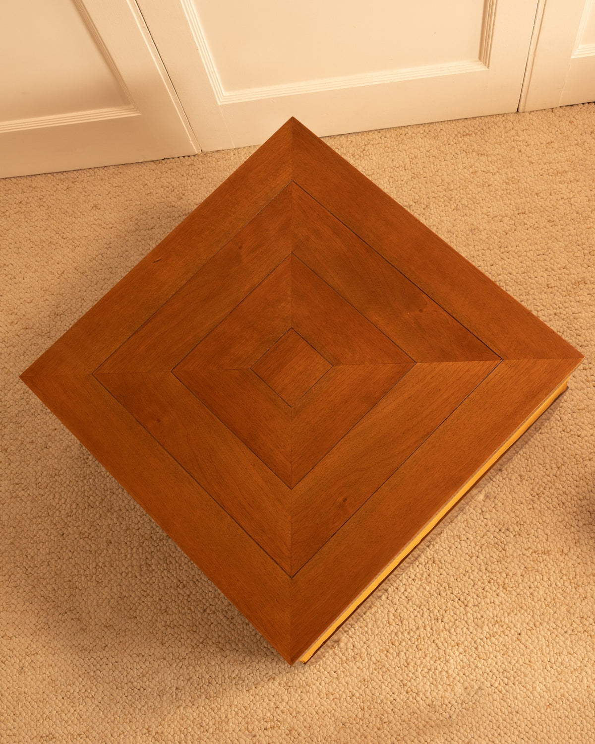 Top view of diamond-patterned teak coffee table by Paolo Buffa