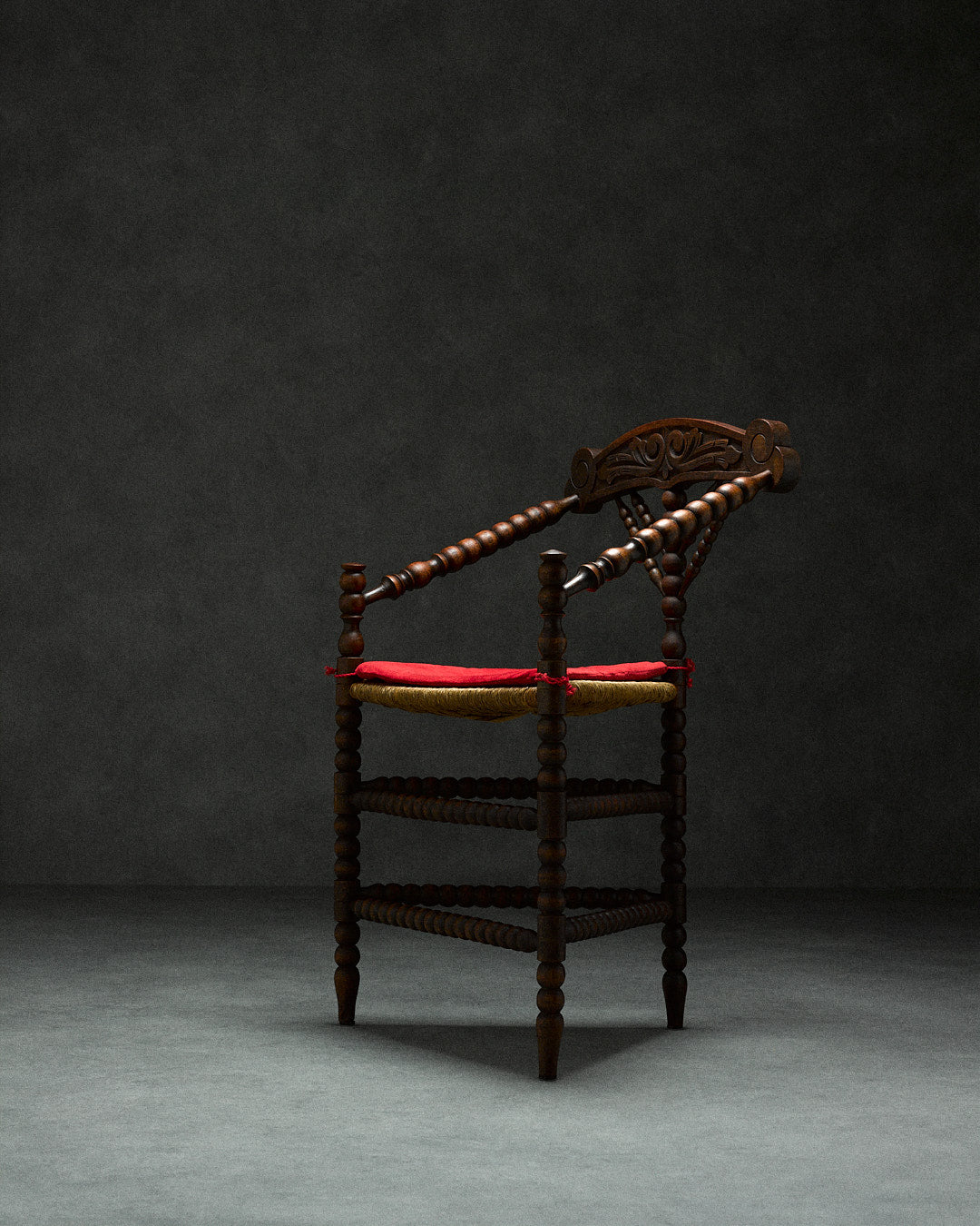 triangular bobbin chair — side angle with dark wood and red seat