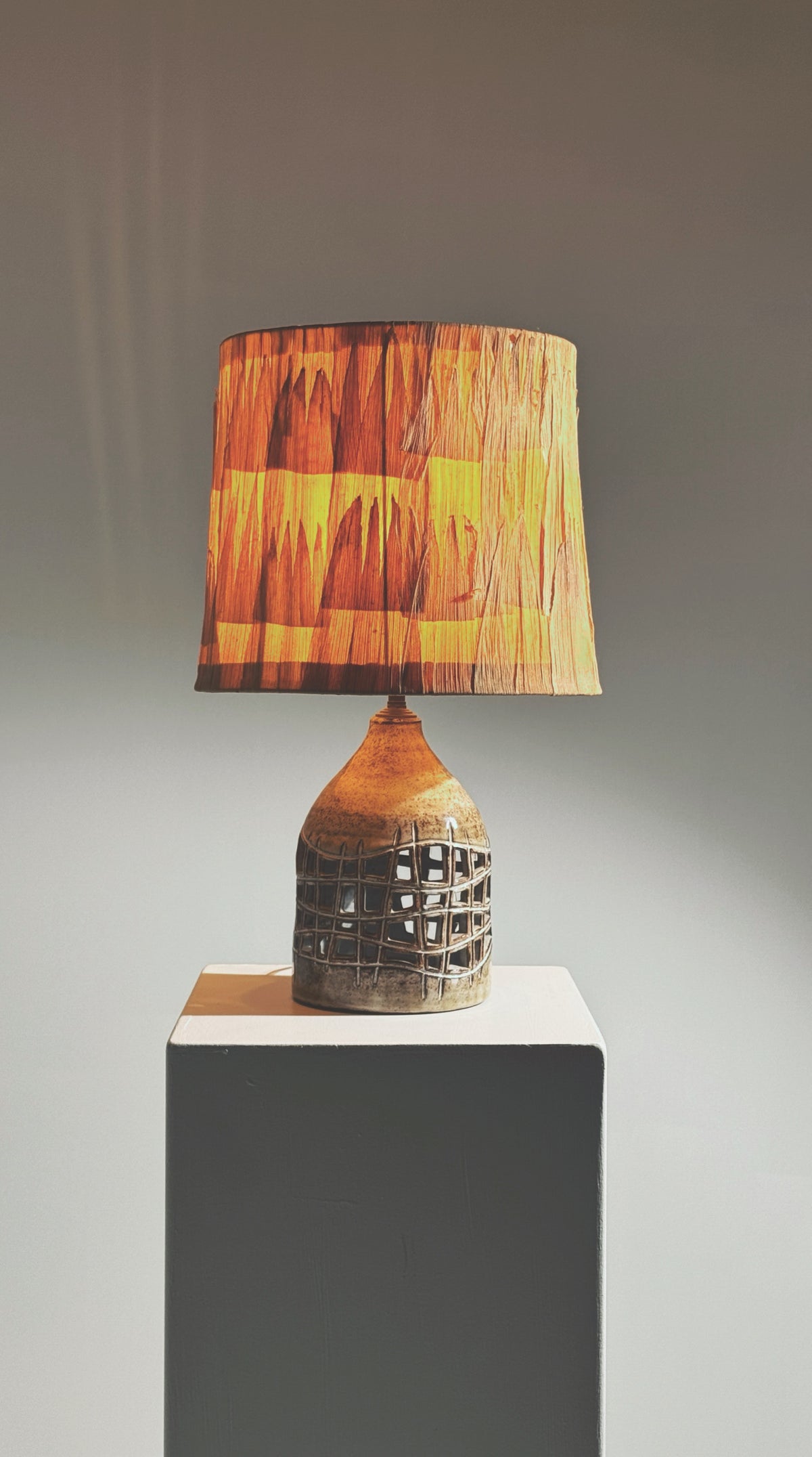 Elegant pierced lamp by Robert Pérot, Vallauris, France, circa 1960 — side angle showing woven shade and ceramic base