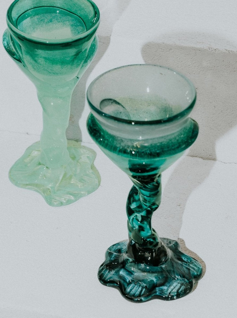 Clear glass cocktail glass with a dark foot, perfect for serving floral-inspired drinks at any event or occasion