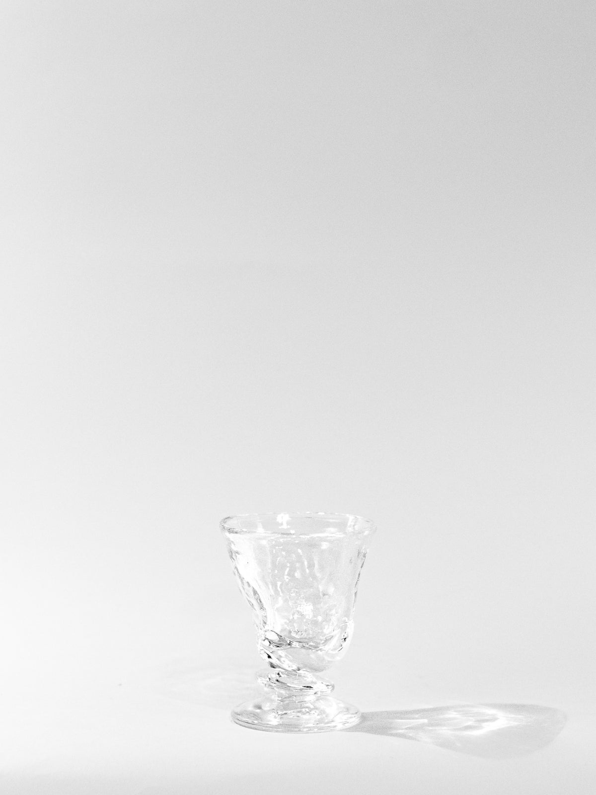 Blown Free-shaped Glass — top view on white background