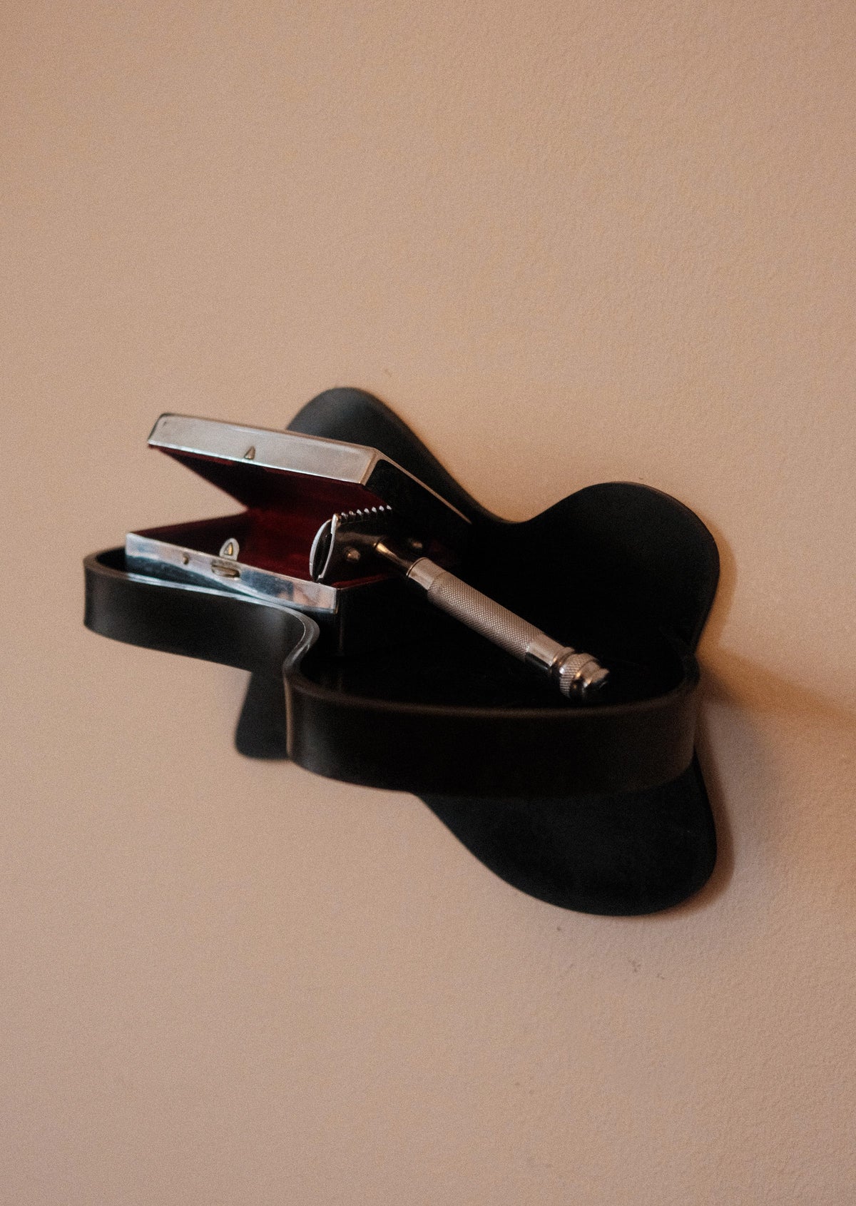 Small Shelf — top view of black wall-mounted design with items