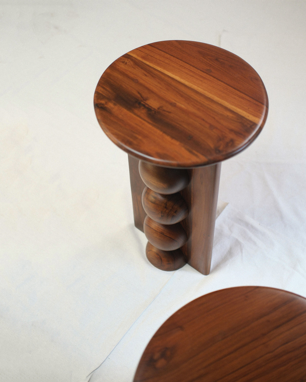 Nemo & Dory' Set of 2 Wood Side Tables — top view showing round wooden surface and curved legs