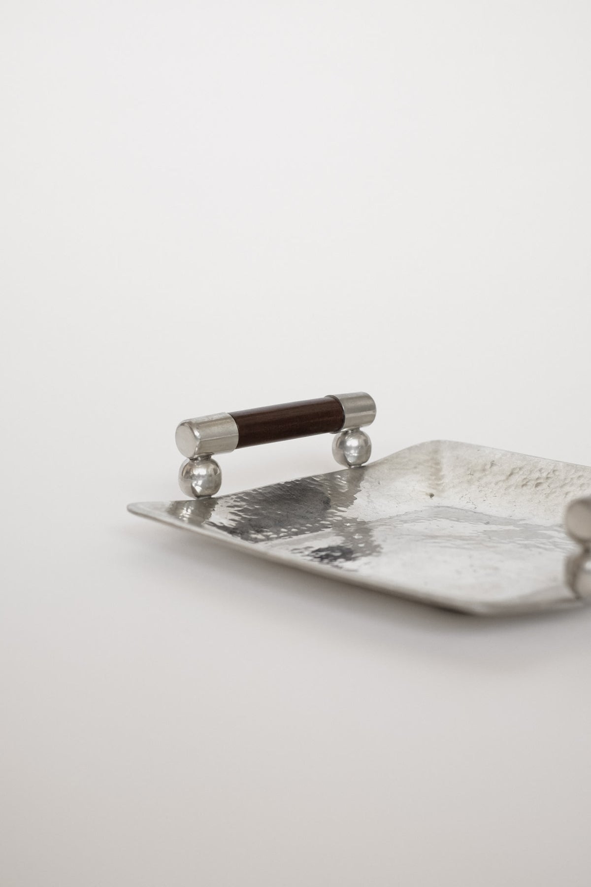 Hammered Pewter Tray with Wooden Handles by Schohaus — close-up