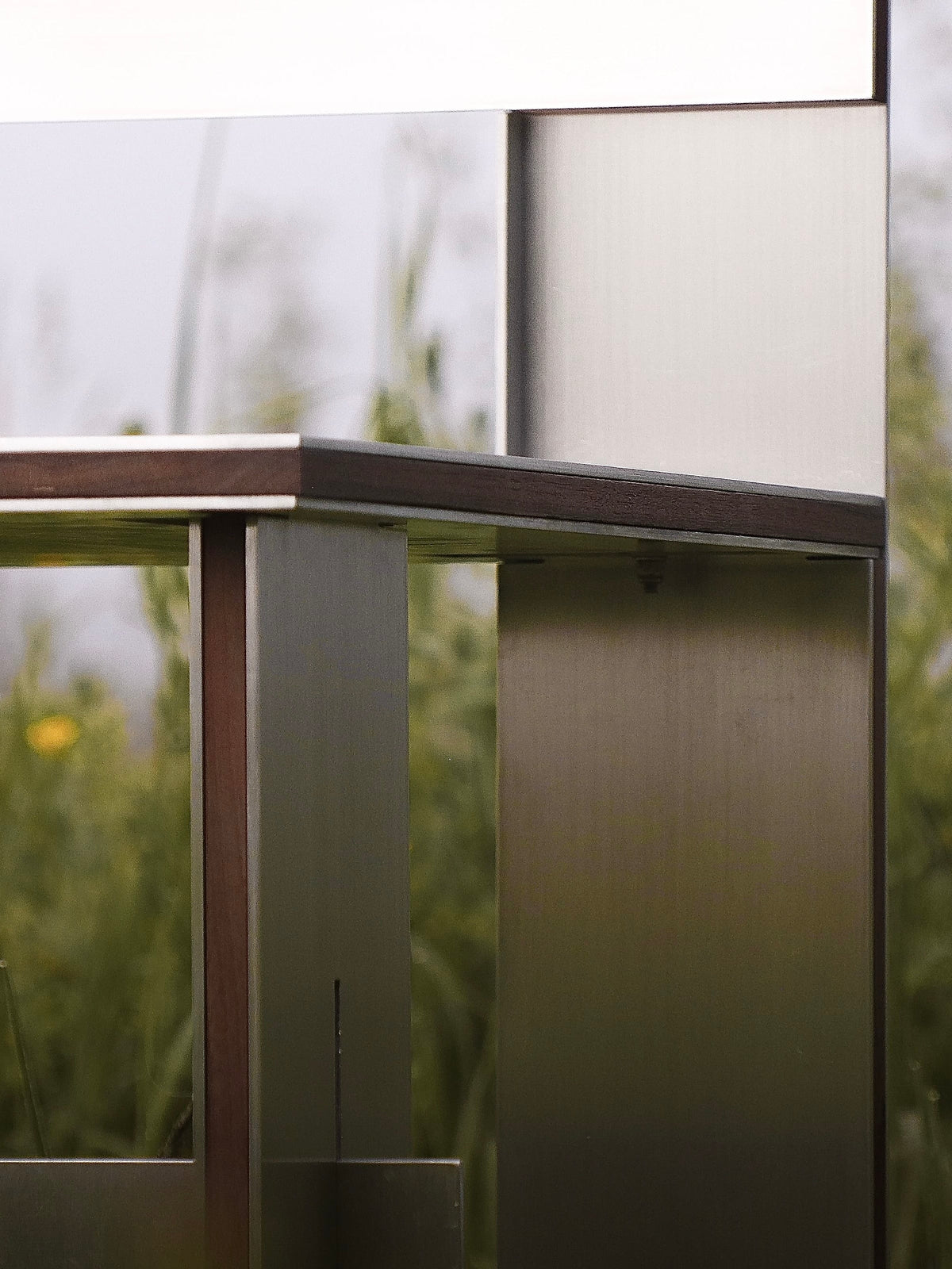 Sandwich Chair — close-up of metal frame and wooden detail