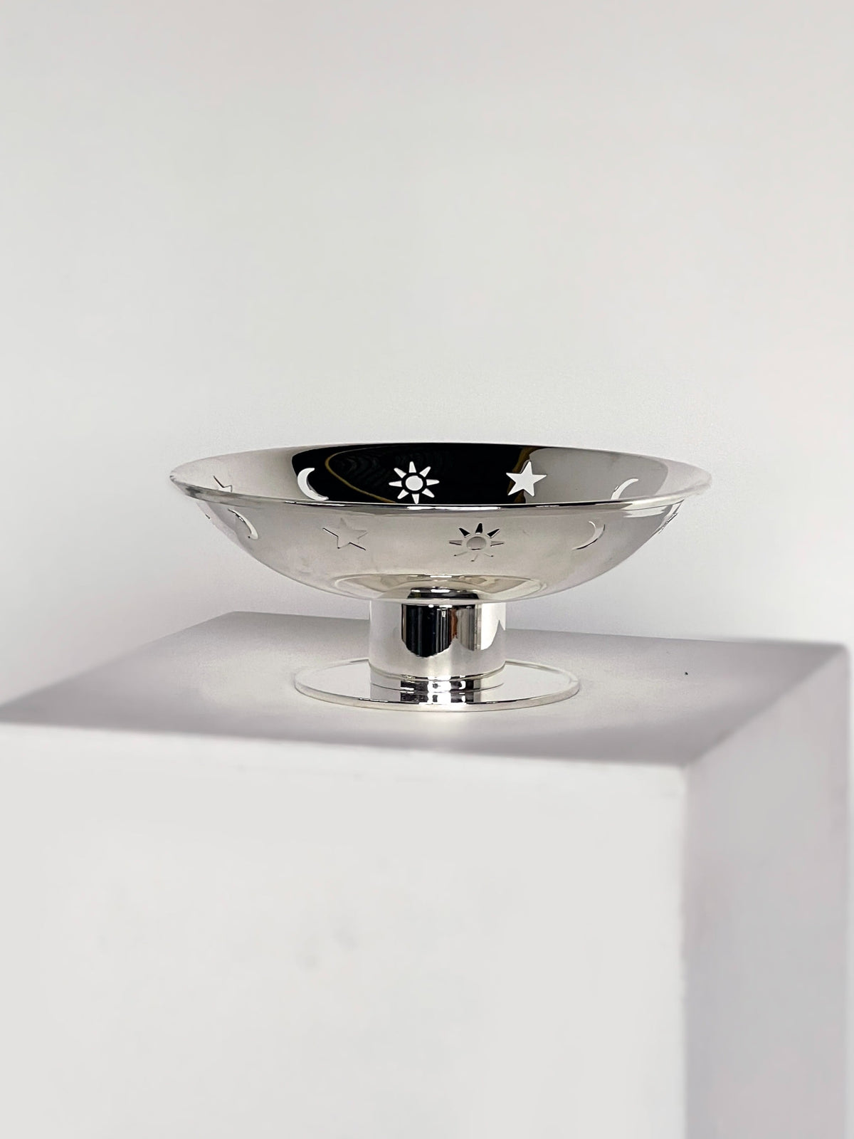 Star, sun, moon dish on pedestal  — detail view