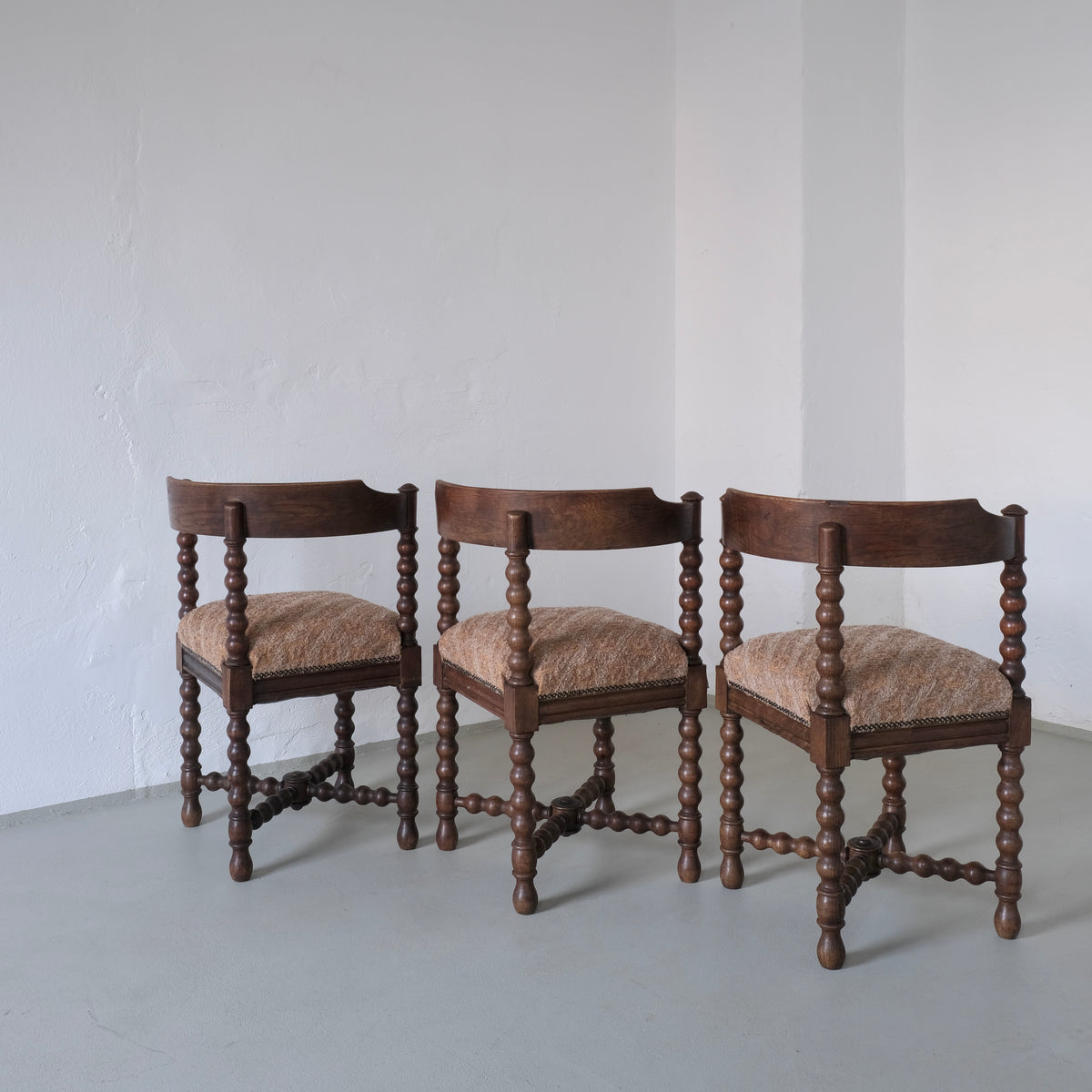 Three antique bobbin turned chairs with upholstered seats