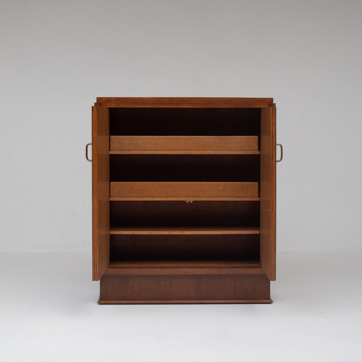 Mid-Century Oak Cabinet with Brass Handles and Decorative Inlays — detail view