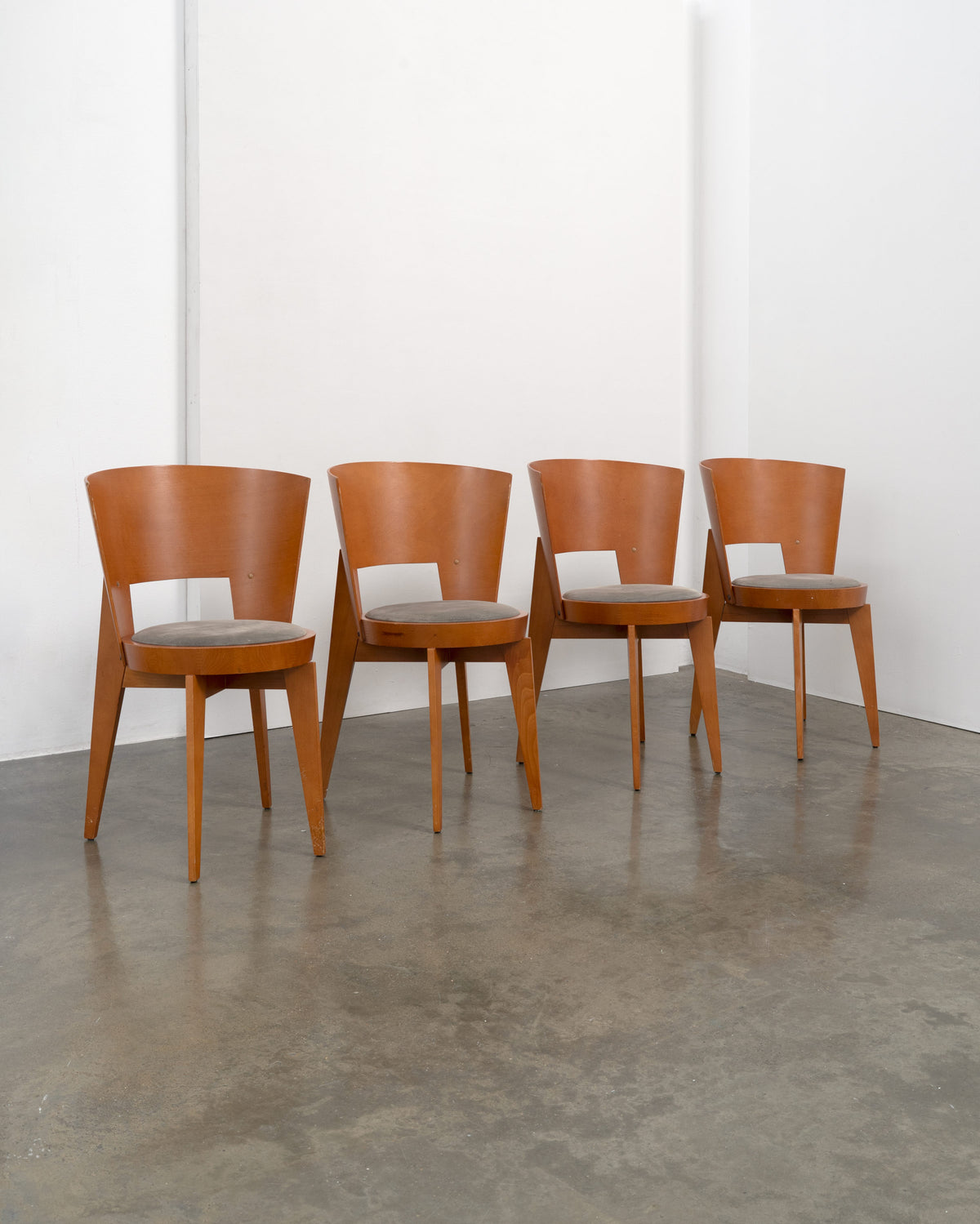 4 "Ola" Dining Chairs designed by Pascal Mourgue — side angle showing wooden frames