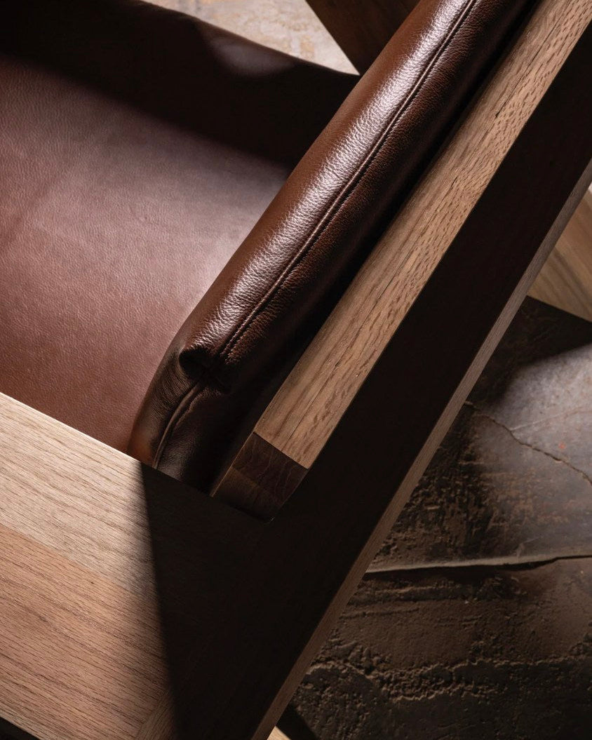 Brown leather upholstery detail of TTR lounge chair frame