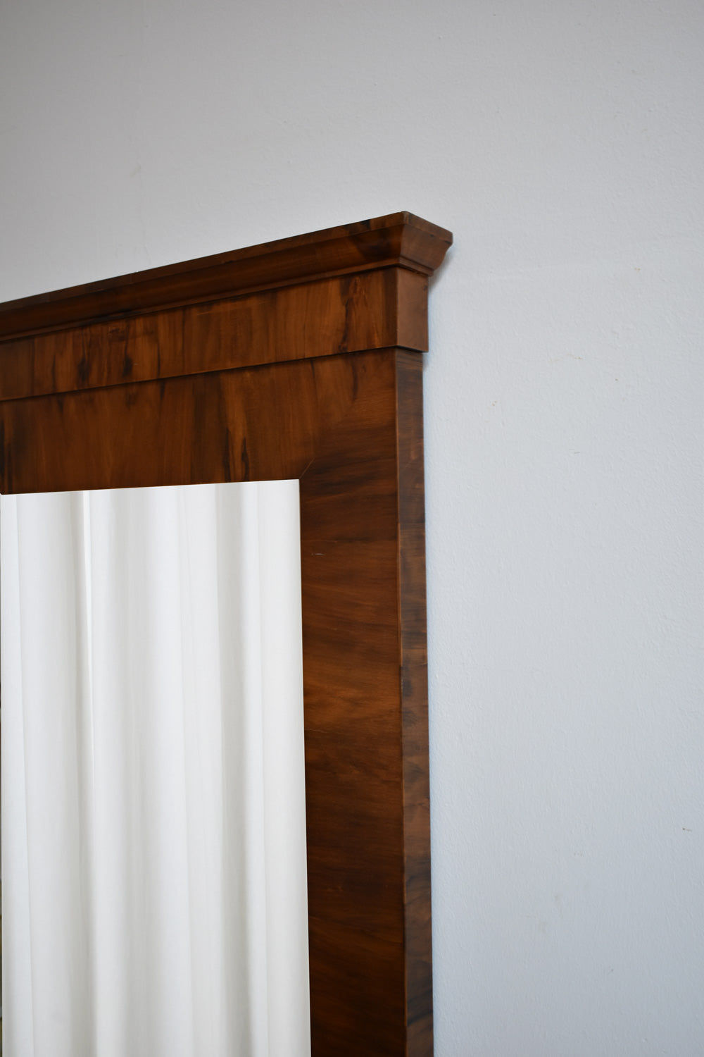 Empire Style Mahogany Beveled Mirror, 1940s — angled view highlighting rich wood grain