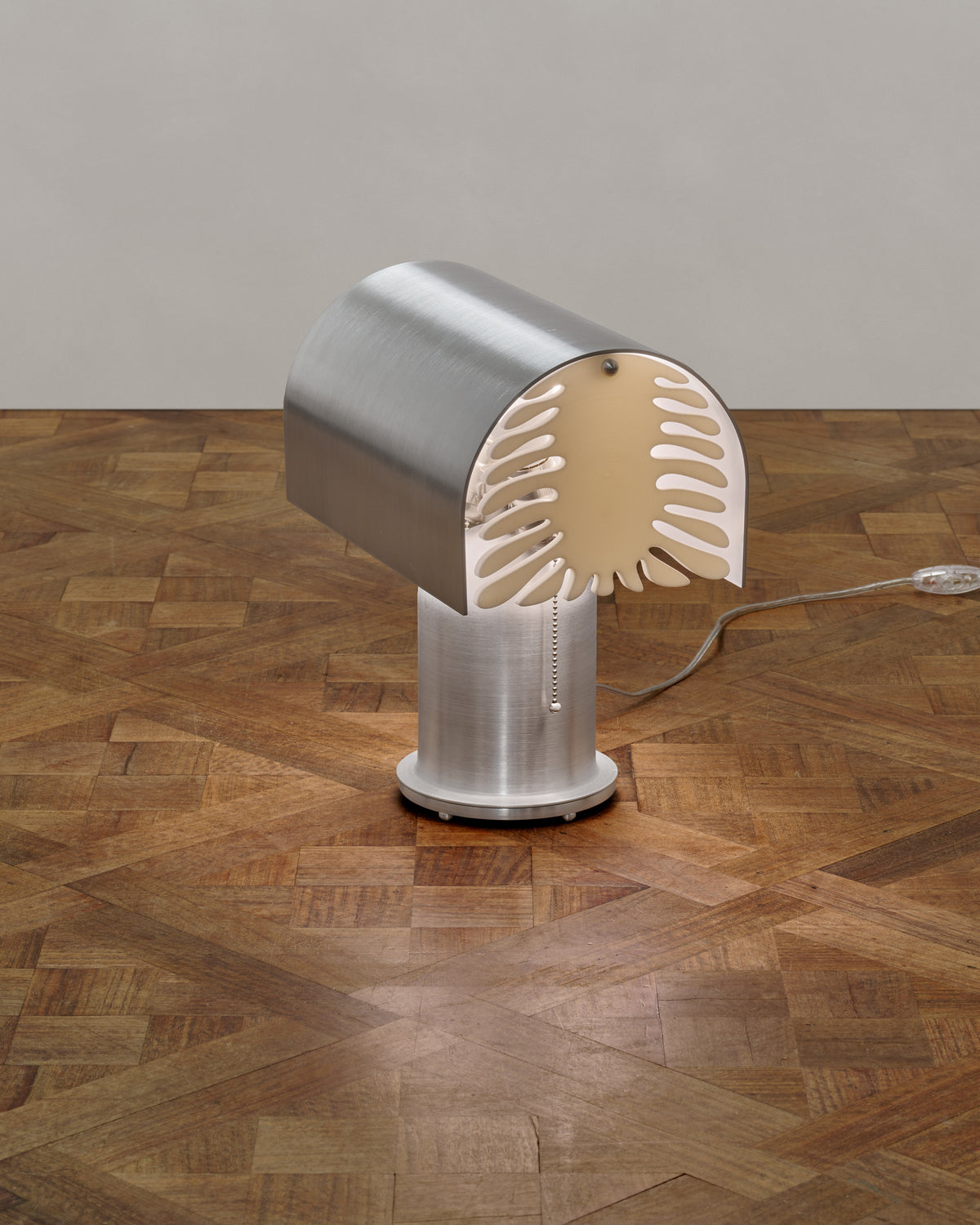 Modern brushed steel Bloom table lamp with warm LED lighting detail