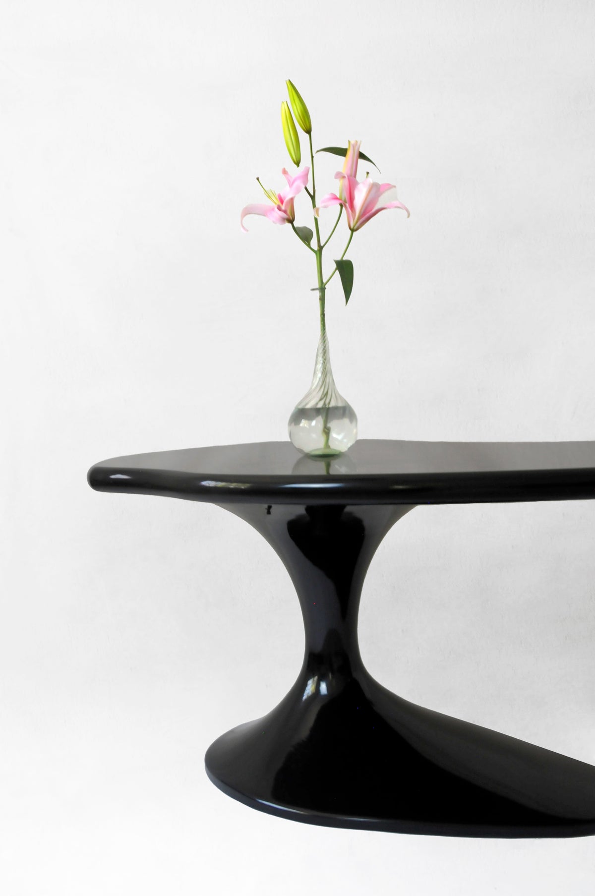 Piano Desk in Lacqued Wood — side angle with floral arrangement on top