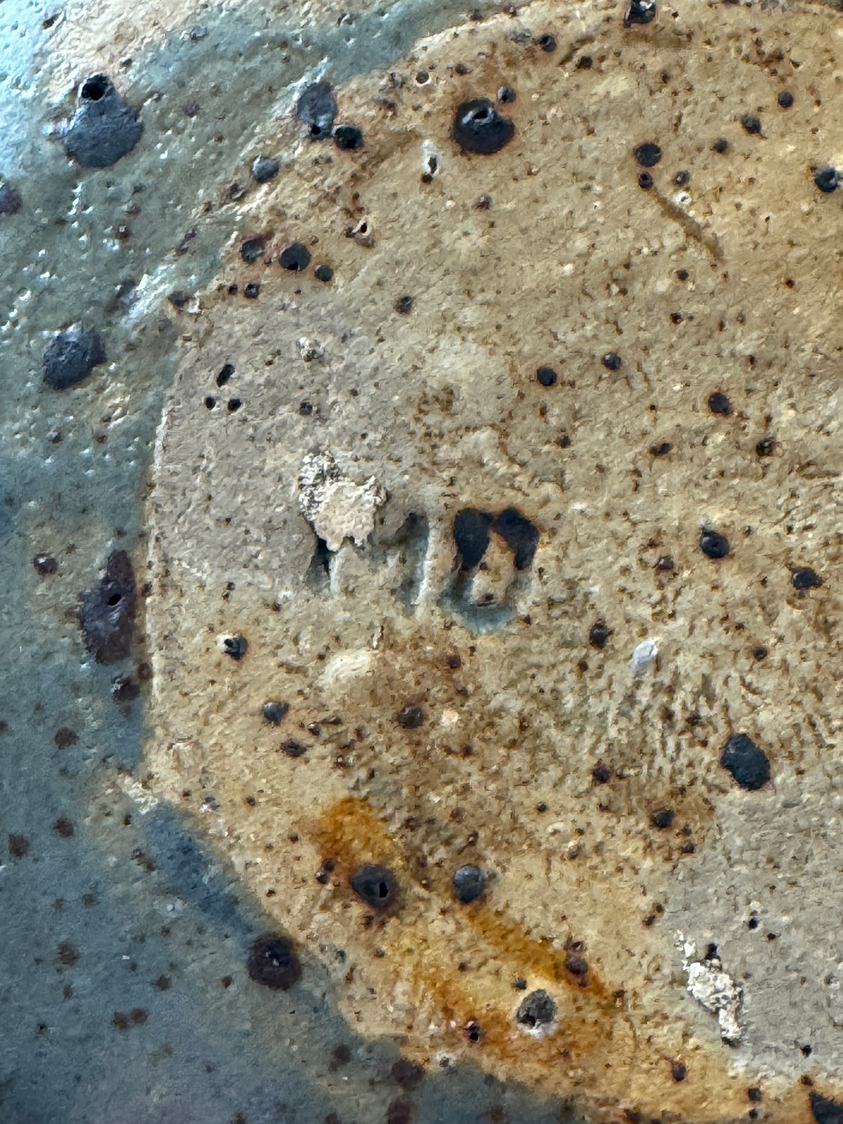 Textured surface detail of 1960s French stoneware flower frog vase