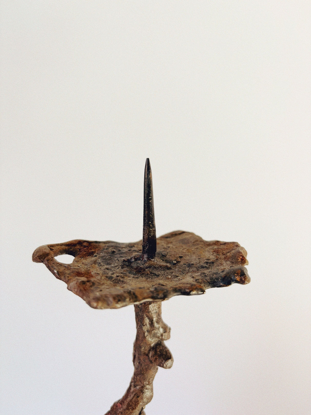 Metal 3 Arm Brutalist Candelabra, Poland — close-up of textured metal base