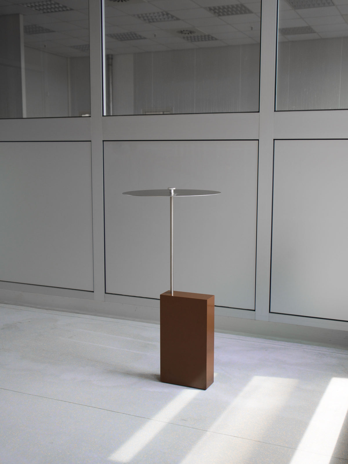 The Assistant' Side Table — top view of modern metal and wood design