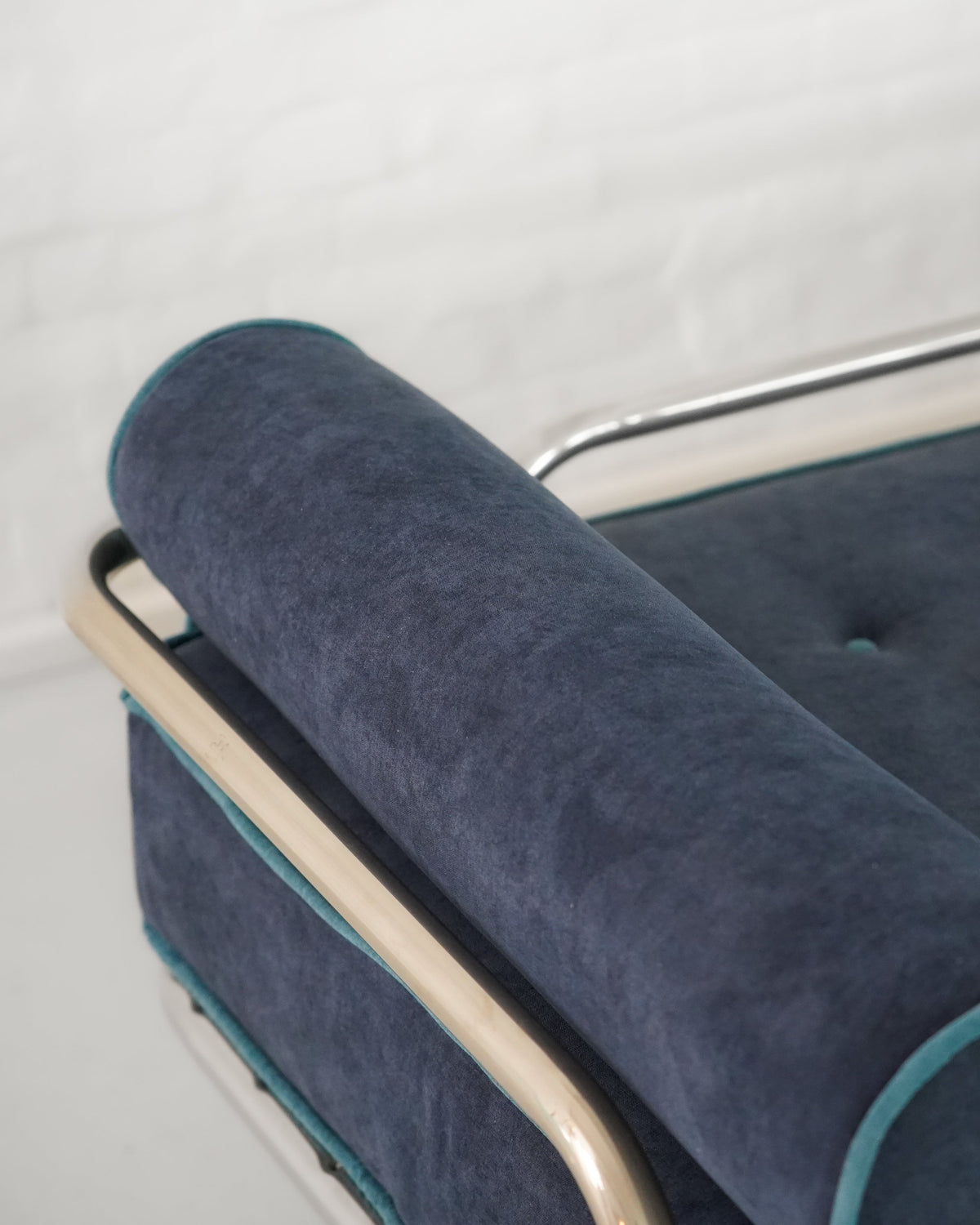 Close-up detail of navy velvet upholstery on Locus Solus daybed