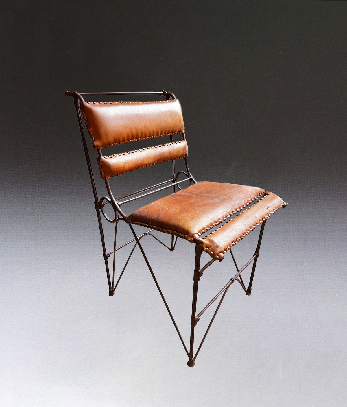 Pair of Brutalist Chairs by Ilana Goor — side angle showing brown leather seat